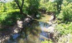 55ac M/L Rolling hill top to river bottom land, Historic Mine creek is the border of this recreational farm, the hills are dotted w/mature Oak,Walnut timber, has a metal building, electricity and RW meter, build home or bring your motor home to enjoy