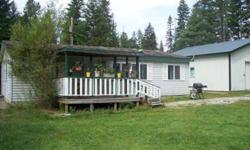 Escape away to privacy with this cozy 3 bedroom 2 bathroom home tucked in on close to 5 acres with a great 30X30 insulated garage/shop! If you are looking for a great deal...it is here! Plenty of room for your animals and toys! Conveniently located near