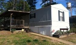 Our trailer has 2 bedrooms and 2 baths, it is in the front of the neighborhood and very close to the tiger transit stop, office, and pool. We have a covered porch and porch swing. There is fresh paint in the kitchen, and we will be leaving the washer,