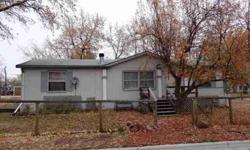 Manufactured home on own lot. Mature trees, fenced, deck on back. 2 car oversized detached garage. Wood burning fire place.Listing originally posted at http