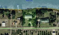 Lakefront building lot on Lake Reedy with 150 feet of frontage.There is a total of 4 adjacent parcels consisting of this 150 foot vacant lakefront lot, a 3/4.5 with 195 feet of lakefront, a 75 foot vacant lakefront lot and a 2/1 on 75 feet of lakefront.