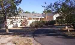 Beautiful spacious 3 bed room, 2 bath, ranch style home in Pahrump Nevada, on about 2 acres. Home is well cared for, formal living room, and separate huge family room with a wood burning fire place. Nice trees and land scape, covered patio, and sprinkler