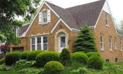 Charming English Tudor looking for that buyer who wants to do some updates to a well built home. This property features four bedrooms, formal living room with woodburning fireplace, formal dining room, Hardwood floors under carpeting, coved moldings,