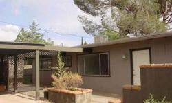 Location, Location ! Check out this cutie! 2 bedrooms and 2 baths, large living room and formal dining room. Nice size kitchen with many cabinets (needs appliances). 2 car covered carport with storage cabinets.Front patio has views of the Red Rocks.walk