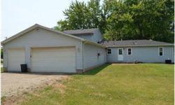 If you are looking for a large home with room for all of your cars, trucks, boats, ATVs and even your mother in law, look no further. This house has 5 bedrooms, three on the first floor with two full baths and 2 on the second floor with one additional