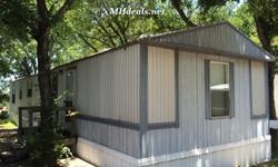 Here we have an extremely cheap yet well standing single wide home. This home houses 2 bedrooms and 2 bathrooms and holds all of your utility needs. It is a cozy 896 square feet or 16 x 56. The home flooring is both tile laminate and wood laminate through