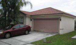 4 bedroom 2 bath home in West miramar with a 2 car garage. The property is in move in condition and features real wood floors. Split bedroom plan, master suite has dual sink with vanity changing area. The kitchen features stainless steel appliances and an