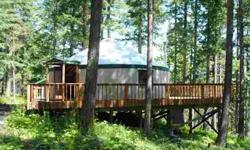 The perfect getaway place for those who want to rough it--in style. The 15 view acres includes a 700 sq. ft. yurt on a large permanent deck and provides the amenities of home including electricity and phone service. The owners have drilled the well for