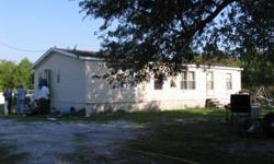 Double wide mobile home on over 4 acres of land in Frost Proof. There currently is no access to subject property. Buyer will need to have driveway cut in to access home. This is a 3 bedroom and 2 bath unit located on 4 acres of land zoned agriculture.