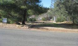 Very nice and shady corner lot. Mature trees and lined in blooming oleanders. Small fenced pet area. Driveway in front and in the rear. All utilities and septic are on the property.Listing originally posted at http