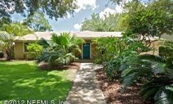 Live at the beach for less!! Beautifully landscaped, spacious 3 bedroom, 2 bathroom home. Florida room with fireplace. Built in bookshelves, tile and wood throughout main living areas and carpeted in bedrooms. Buyer to verify square footage. The seller is