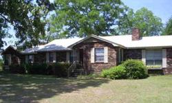 Beautiful3 Bedroom/2 Bath, well maintained, brick home nestled under oak and pecan trees on 34.6 acres. This home features warm tongue and groove woodwork with cedar ceiling beams. Recent updates of new metal roof, additional insulation, remodeled baths,