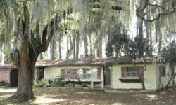Lake Eustis Frontage. What an opportunity to own nearly 3/4 of an acre directly on Lake Eustis. Sit on the dock and watch the sunsets and the sailboats. This home has room to grow and endless possibilities situated on a lot of giant cypress trees. The