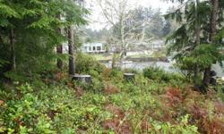 Picturesque setting to build your home on one of the finest canals just shy of Duck Lake~This 8,988 sq ft property would be the perfect place to plan your vacation get-away~Selectively clearing the home site, you would be high on a hill with a gradual