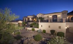 This beautiful custom Las Sendas Estate sits at the top of Pinnacle Ridge and backs to the Tonto National Preserve with incredible city light and mountain views! Grand foyer featuring a beautiful rounded ceiling with wood plank & beam accents. Elegant