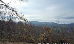 -Spectacular views from this 1.29 ac lot in Rambling Hills subdivision, convenient to Hendersonville & Brevard. City water available, paved roads & underground utilities. This lot goes from street to street and is available as a package with lot #38 for a