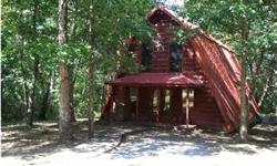 Chalet with wooded privacy located in quiet cul-de-sac in prestigious area; within minutes of downtown Albertville. Approximately 3 acres with winter time bluff view. 3br/2ba chalet w/multi-level decks & small pool. Enjoy Gatlingburg-like atmoshpere at
