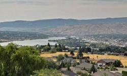 The most majestic view in the Valley! You feel right on top looking down on the Columbia River, City Lights of Wenatchee, mission Ridge and the Cascade Mountain Range. There is not another home like this in the area. There is also a 960 square foot RV