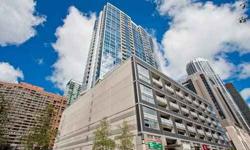 Sun-filled corner unit, sleep split 2 bed/2bath + office niche. 1358 Sq ft, 9'4" ceiling, hardwood floors, SS appliances, granite, marble bath, double vanity, highly upgraded. Fab views of Chicago Tribune, Wrigley, NBC Tower & river. Full amenity