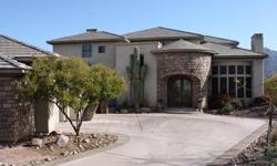 Beautiful home in Superstition Mountain Golf & Country Club. Located on the 7th tee box (gold tees) of the Lost Gold Golf Course, this home has gorgeous views of the Superstition Mountains. Uniquely designed custom home with outstanding quality &